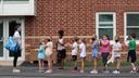 Students line up after recess for their third grade teacher Ms. Melissa Russo, far left, at Lower Gwynedd Elementary School in Ambler, PA, Thursday, September 3, 2020. The school's outdoor policy is that masks are worn outdoors if the person is within 6 feet of another person outdoors. Masks are required at all times indoors. JESSICA GRIFFIN  / Staff Photographer